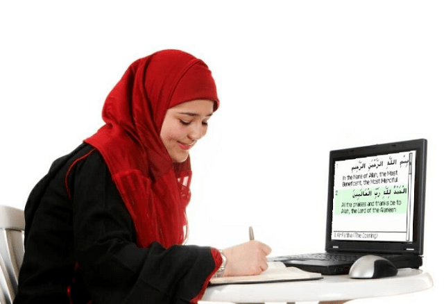 A women teach Quran online of his students by laptop.